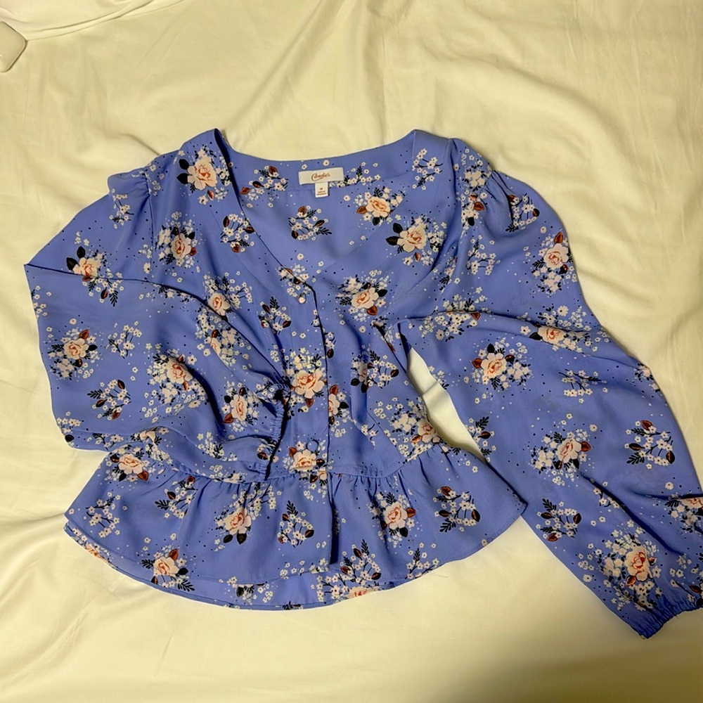 cute blue floral top with a small button up and cute ruffles on the bottom!